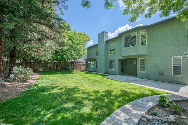 exterior space with fence and a patio area