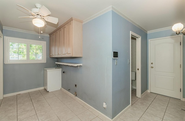 washroom featuring crown molding, light tile patterned floors, electric dryer hookup, and cabinet space