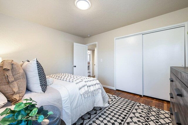 bedroom with a closet and wood finished floors