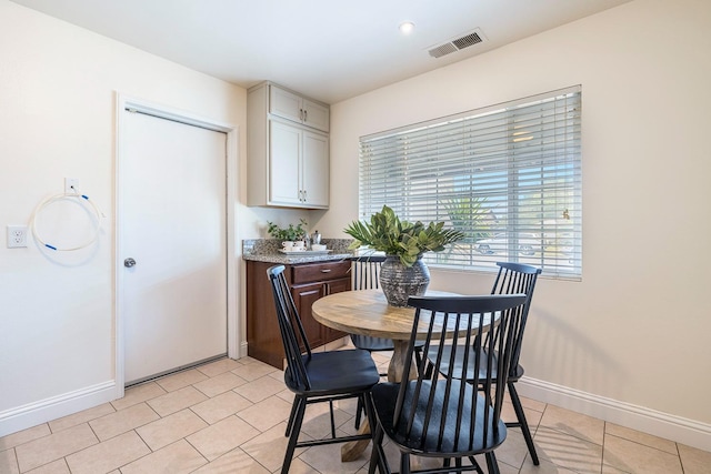 dining area with baseboards and visible vents