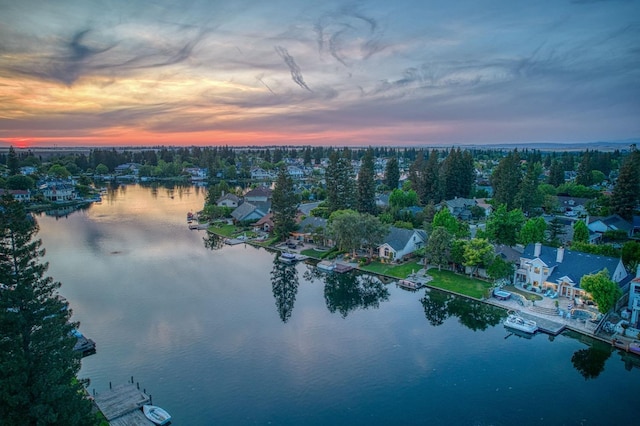 aerial view at dusk with a water view