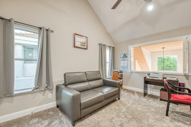 interior space with carpet floors, baseboards, and high vaulted ceiling