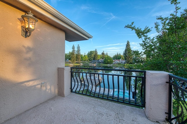 balcony featuring a water view