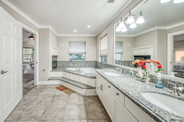 full bathroom featuring visible vents, a sink, ensuite bath, and a fireplace