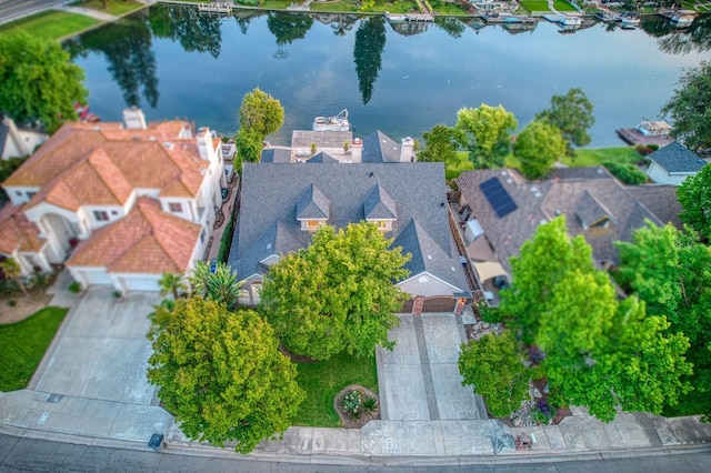 bird's eye view with a water view and a residential view