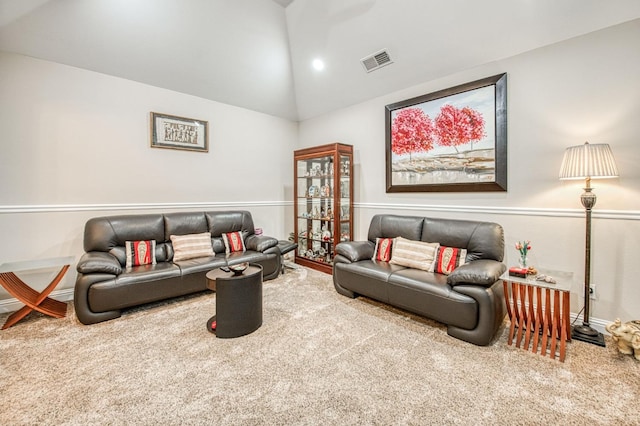 carpeted living area featuring high vaulted ceiling and visible vents