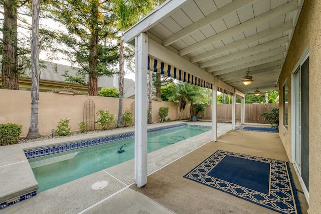 view of pool with a fenced backyard, a fenced in pool, a patio, and ceiling fan