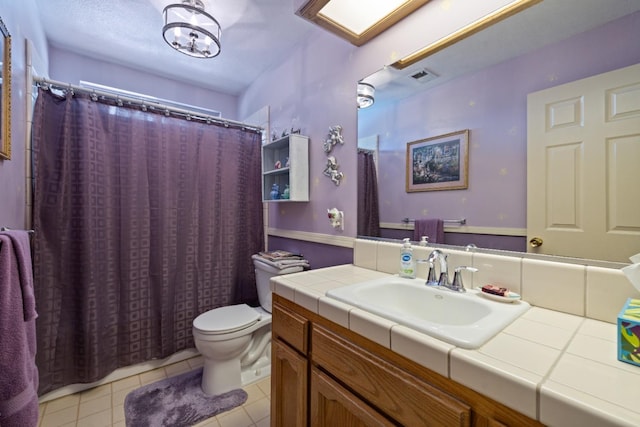 1215 Fremont Ave, Clovis, CA 93612 - full bath with visible vents, tile patterned floors, toilet, and vanity
