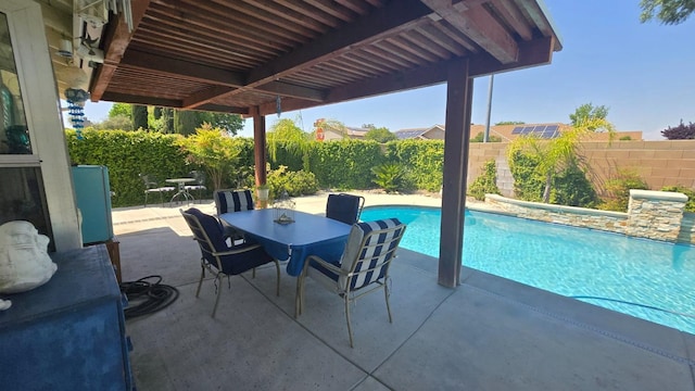 1215 Fremont Ave, Clovis, CA 93612 - view of pool featuring a patio, a fenced in pool, a fenced backyard, and outdoor dining space