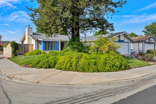 1215 Fremont Ave, Clovis, CA 93612 - view of front of property with a garage, fence, and a chimney