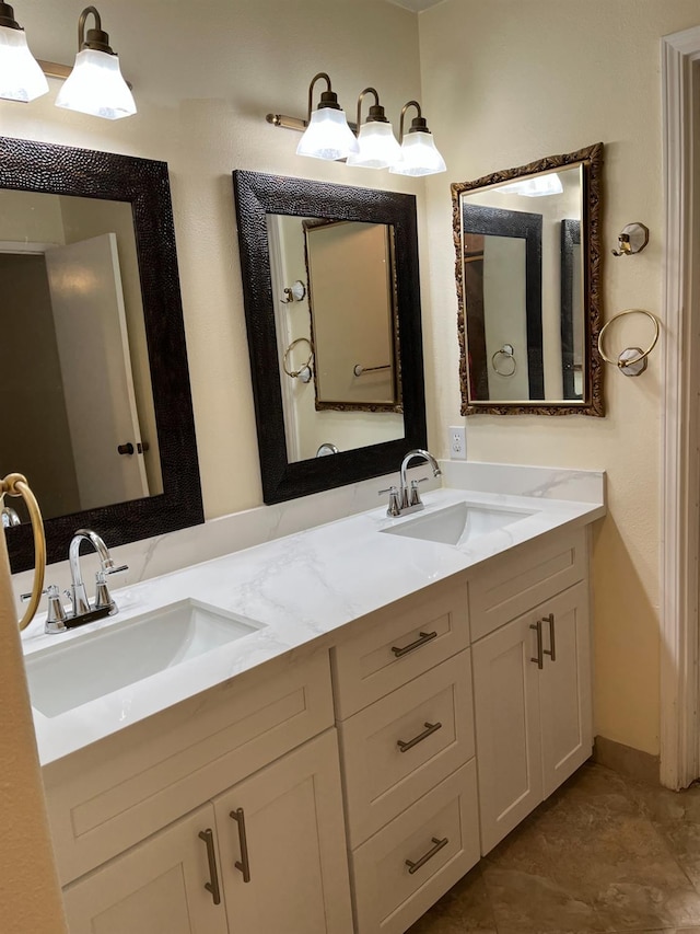 full bathroom with double vanity and a sink