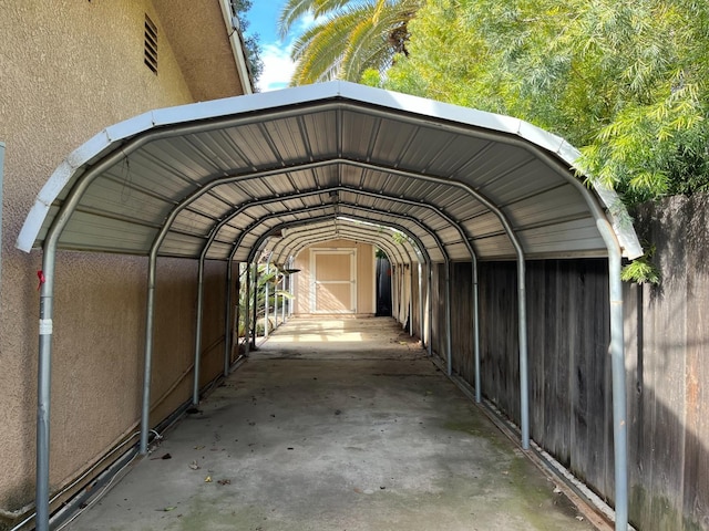 view of parking / parking lot featuring a carport