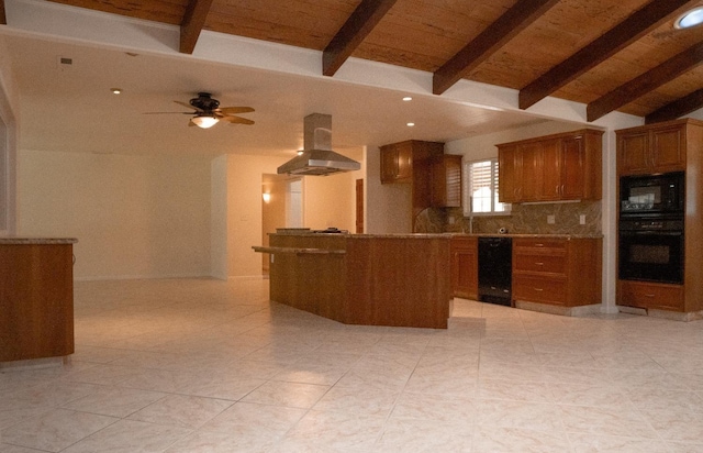 kitchen with brown cabinetry, backsplash, island range hood, light tile patterned floors, and black appliances