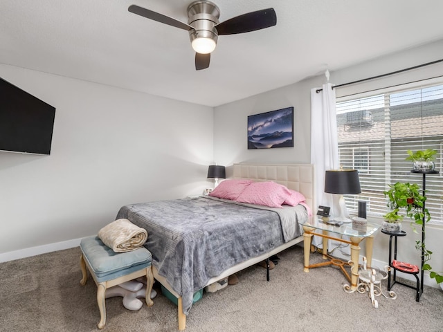 bedroom with baseboards, ceiling fan, and carpet flooring
