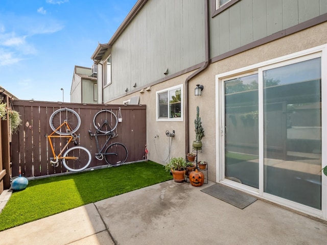 exterior space featuring a patio and fence