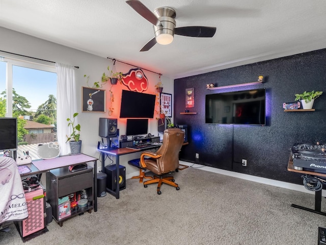 office area featuring baseboards, a ceiling fan, and carpet flooring