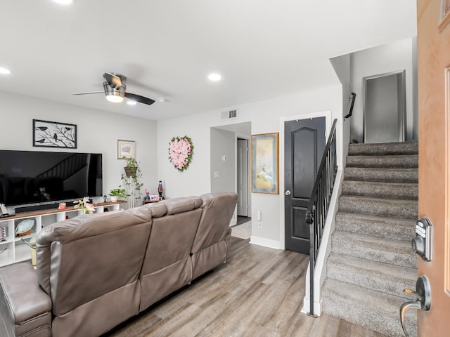 living room featuring visible vents, wood finished floors, ceiling fan, stairway, and recessed lighting