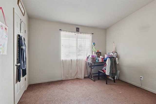 bedroom featuring carpet floors and baseboards