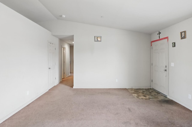 spare room with carpet floors and baseboards