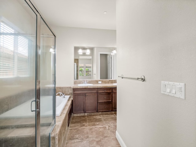 7993 N Justin Ave, Fresno, CA 93720 - bathroom featuring double vanity, a sink, a bath, and a stall shower
