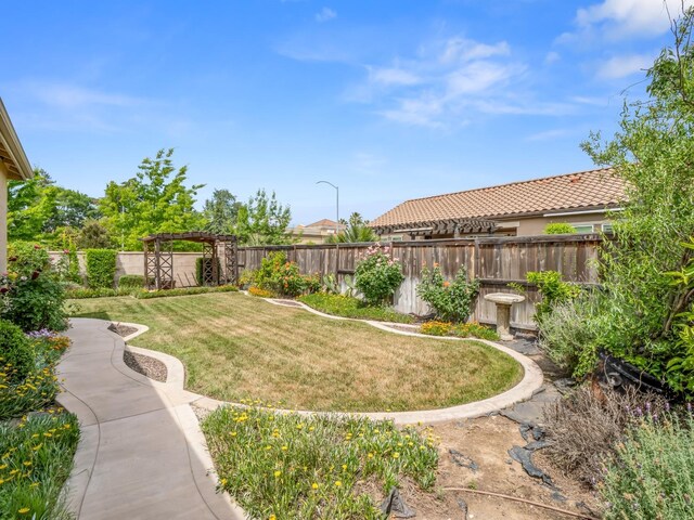7993 N Justin Ave, Fresno, CA 93720 - view of yard featuring a fenced backyard