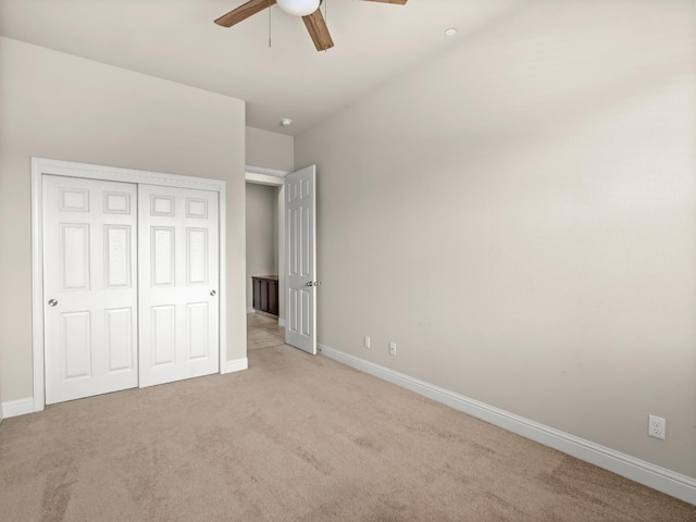 7993 N Justin Ave, Fresno, CA 93720 - unfurnished bedroom with baseboards, a ceiling fan, a closet, and light colored carpet