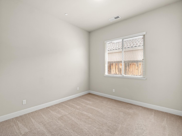 7993 N Justin Ave, Fresno, CA 93720 - unfurnished room featuring baseboards, light colored carpet, and visible vents