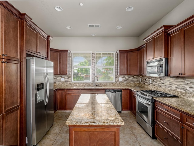 7993 N Justin Ave, Fresno, CA 93720 - kitchen with a sink, light tile patterned floors, stainless steel appliances, and visible vents