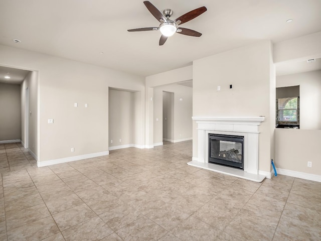 7993 N Justin Ave, Fresno, CA 93720 - unfurnished living room with baseboards, a glass covered fireplace, ceiling fan, and light tile patterned floors