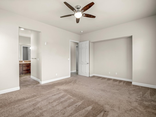 7993 N Justin Ave, Fresno, CA 93720 - unfurnished bedroom with carpet floors, baseboards, ceiling fan, and connected bathroom