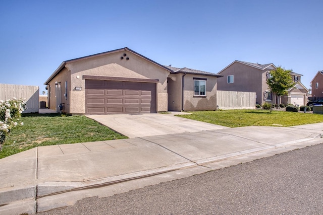 single story home featuring fence, a front yard, stucco siding, an attached garage, and driveway