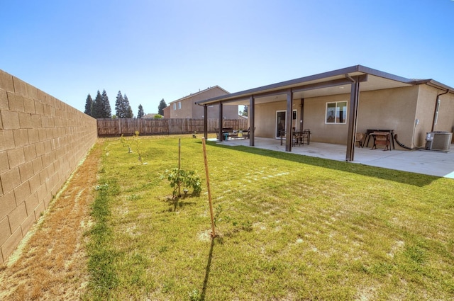 view of yard with a fenced backyard, a patio area, and cooling unit