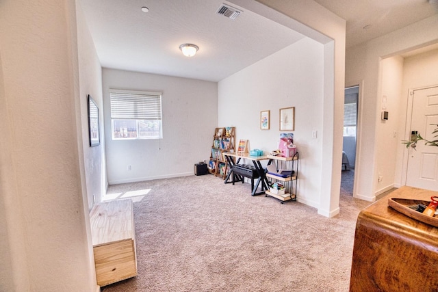 interior space featuring baseboards, carpet, and visible vents
