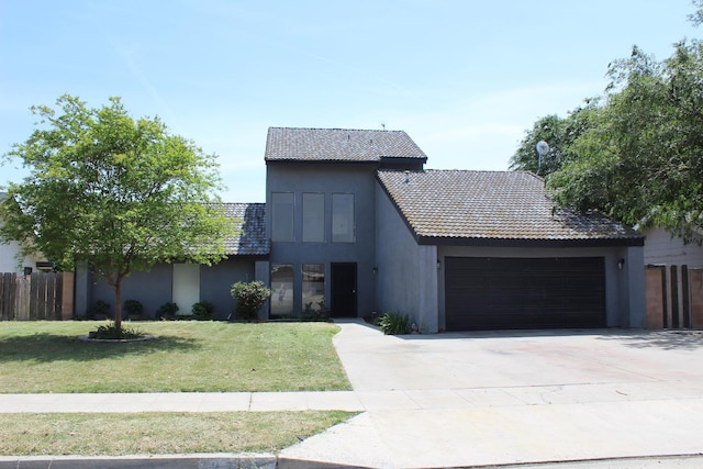 2791 W Kofoid Ave, Caruthers, CA 93609 - modern home with fence, an attached garage, a front yard, concrete driveway, and a tiled roof