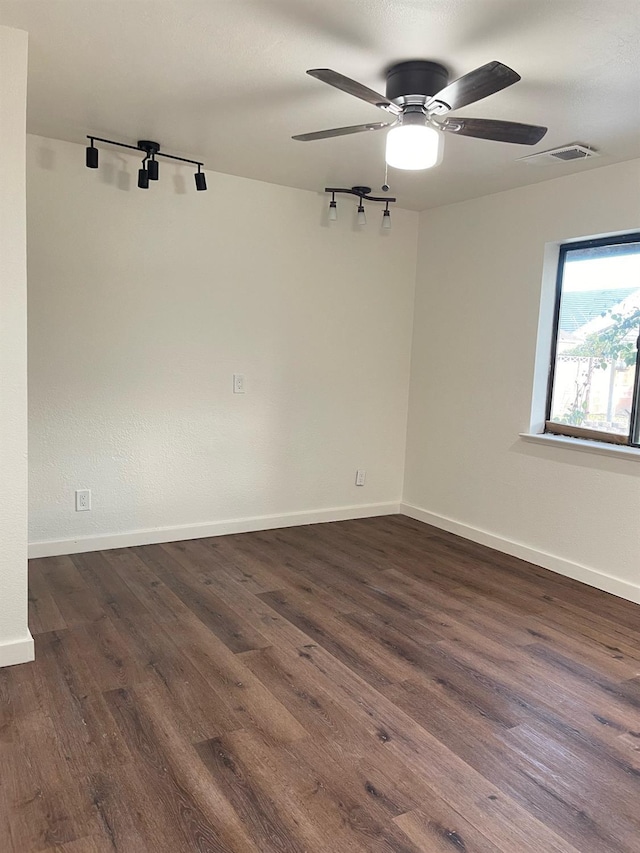 2791 W Kofoid Ave, Caruthers, CA 93609 - unfurnished room featuring dark wood-type flooring, baseboards, and ceiling fan
