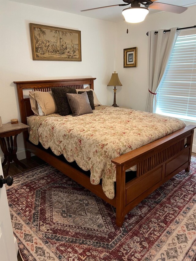 9552 N Whitehouse Dr, Fresno, CA 93720 - bedroom with wood finished floors and a ceiling fan