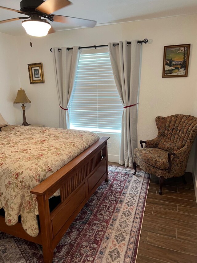 9552 N Whitehouse Dr, Fresno, CA 93720 - bedroom with wood finished floors and a ceiling fan