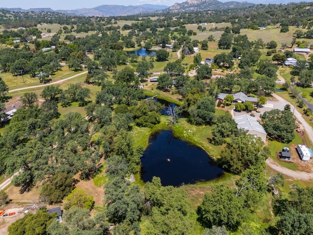bird's eye view with a water and mountain view
