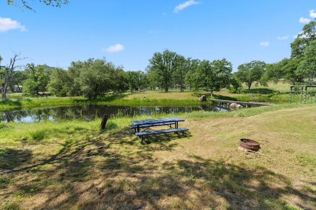 surrounding community featuring a water view