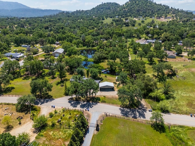 bird's eye view with a forest view and a mountain view