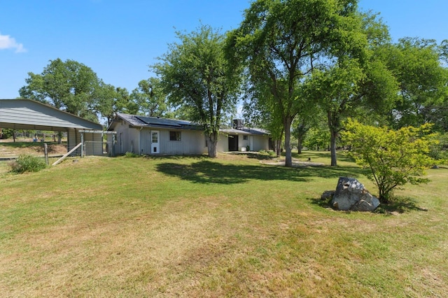 view of yard with a detached carport