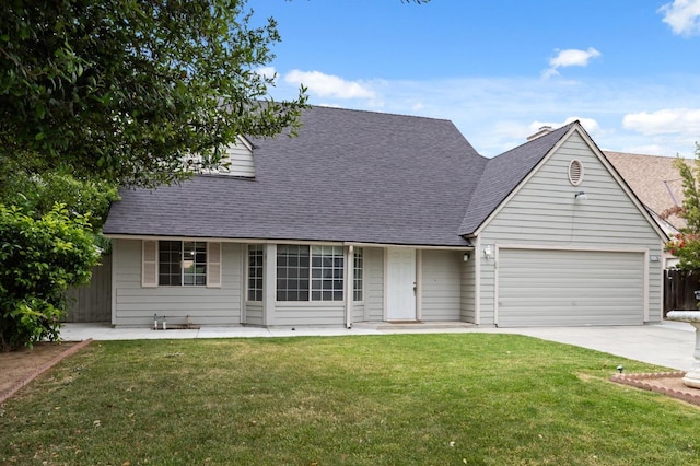view of front of property featuring a front lawn, fence, a shingled roof, concrete driveway, and an attached garage