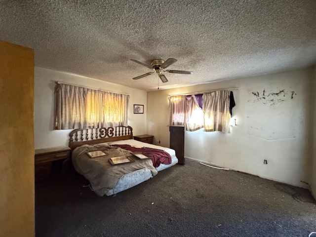 bedroom featuring carpet flooring, a textured ceiling, and ceiling fan