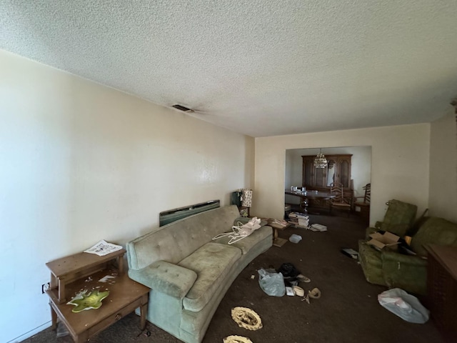 carpeted living area with a textured ceiling and visible vents