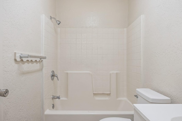635 N San Pablo Ave, Fresno, CA 93728 - bathroom with vanity, a textured wall, bathtub / shower combination, and toilet