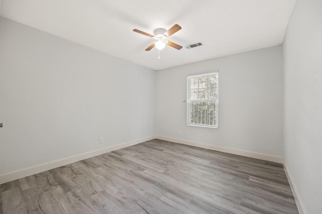 635 N San Pablo Ave, Fresno, CA 93728 - spare room with baseboards, ceiling fan, wood finished floors, and visible vents