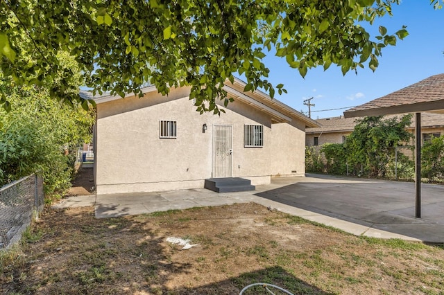 635 N San Pablo Ave, Fresno, CA 93728 - back of house featuring a patio, fence, and stucco siding