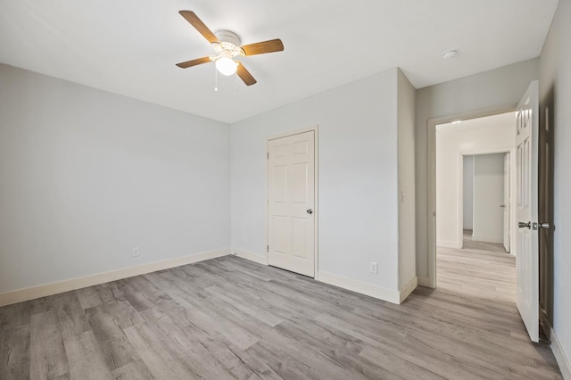 635 N San Pablo Ave, Fresno, CA 93728 - unfurnished bedroom with baseboards, light wood-style flooring, and ceiling fan