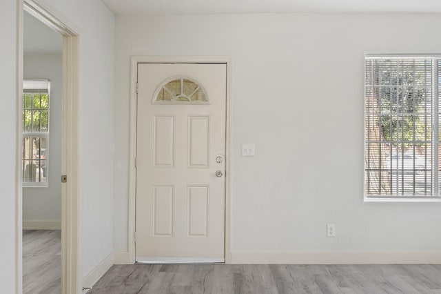 635 N San Pablo Ave, Fresno, CA 93728 - entryway with baseboards and wood finished floors