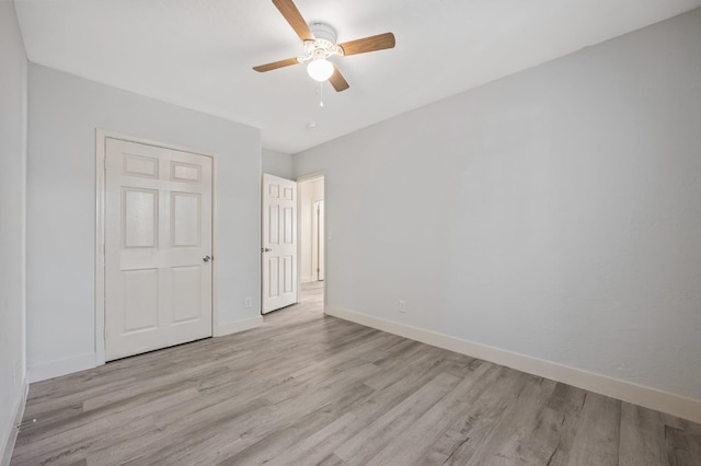 635 N San Pablo Ave, Fresno, CA 93728 - unfurnished bedroom with a ceiling fan, baseboards, and wood finished floors